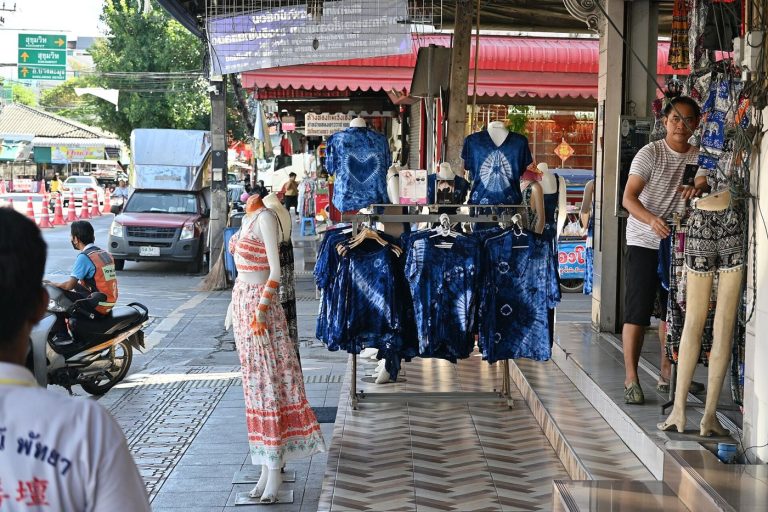 High Streets Measure Footfall After Late-Night Shopping Trial shoppers walking along a busy retail street