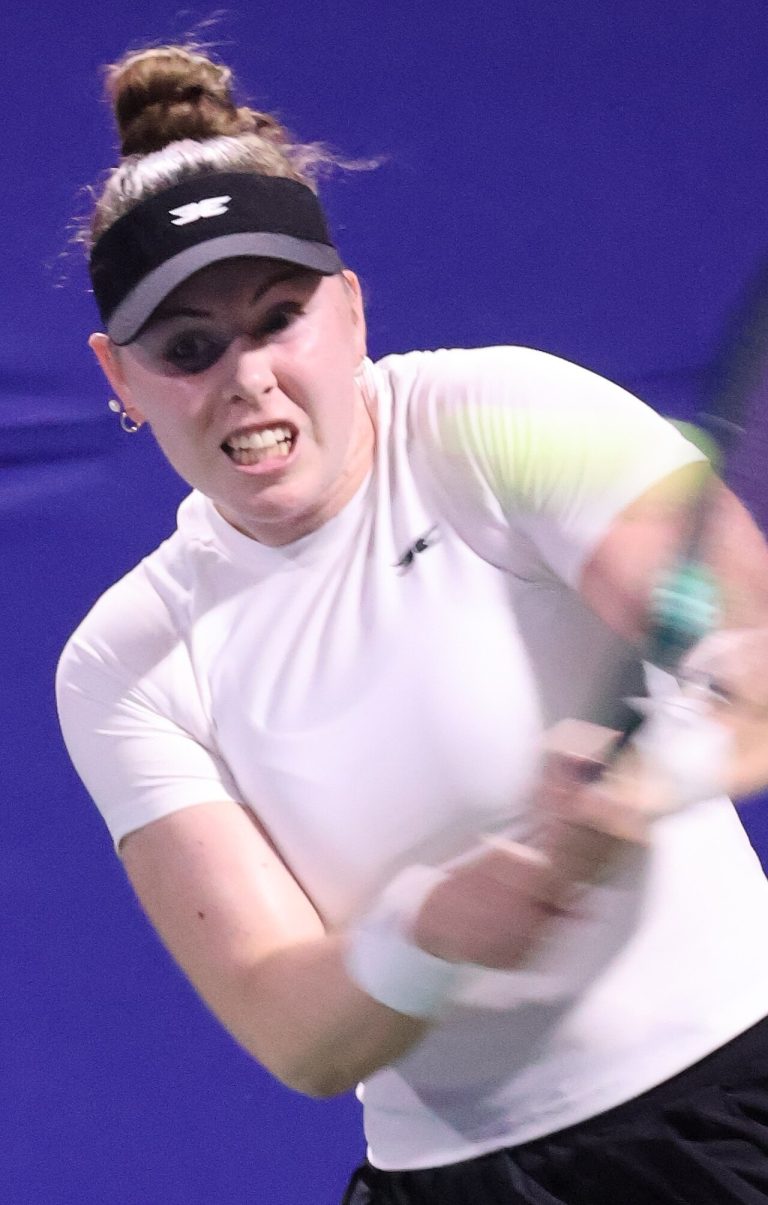 Talia Gibson: The Australian Talent Turning Heads on Tour Talia Gibson playing a forehand during a professional tennis match