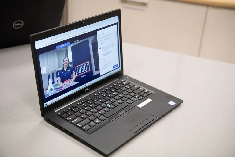 A Moderation Team of One: How Tiny Platforms Cope With a Flood of Uploads A presenter livestreaming to an online audience from a laptop