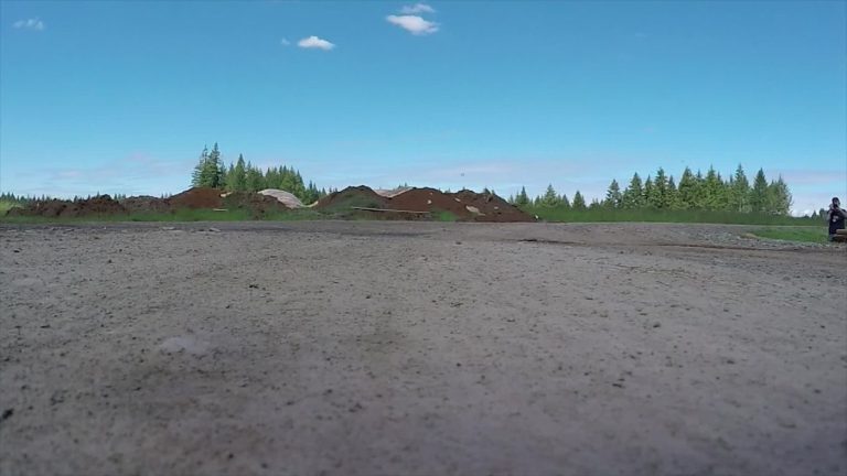A drone carrying a small package in flight