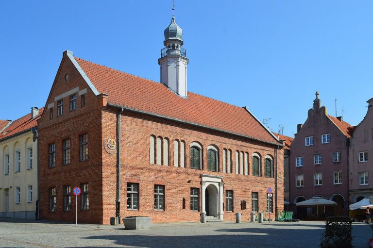 Heritage Cities Test Visitor Caps to Protect Daily Life A historic old town street