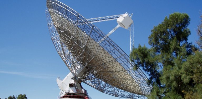 Satellite Internet Reaches the Places Cables Never Will A satellite dish mounted outside a rural home pointing at the sky